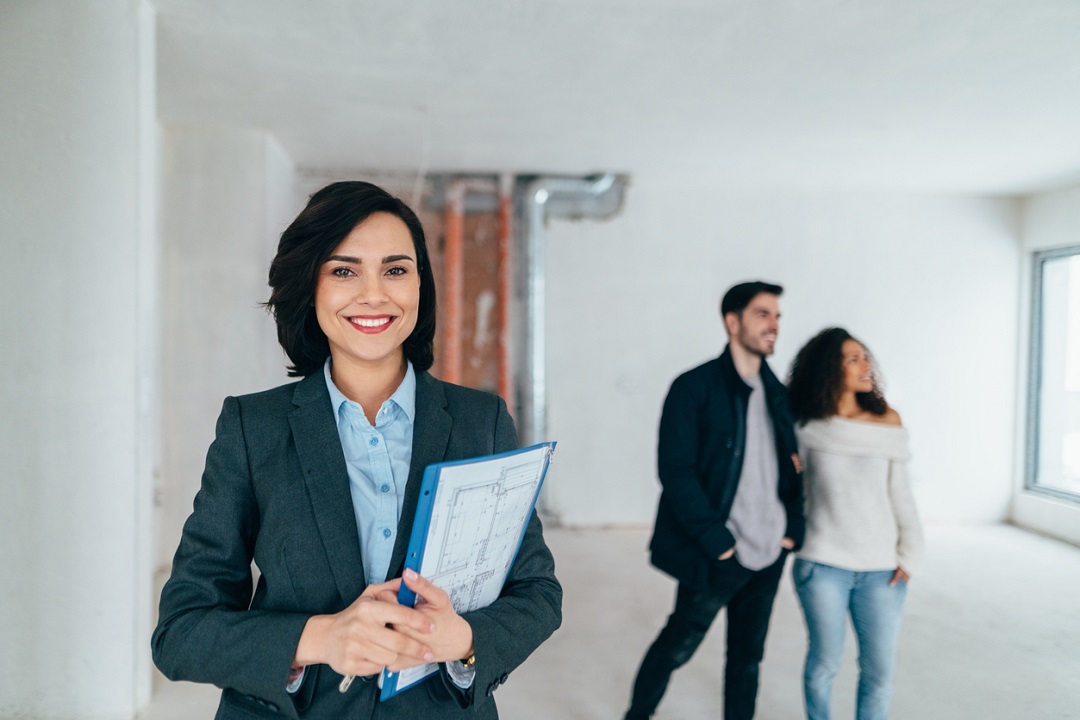 Real estate agent smiling to the camera